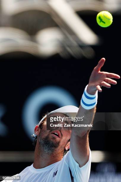 Jordan Thompson of Australia serves in his first round match against Paolo Lorentzi of Italy during day one of the 2018 Sydney International at...