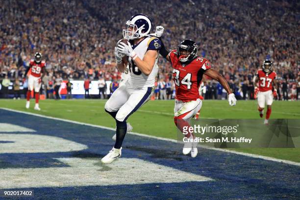 Cooper Kupp of the Los Angeles Rams scores a touchdown during the NFC Wild Card Playoff Game against the Atlanta Falcons at the Los Angeles Coliseum...