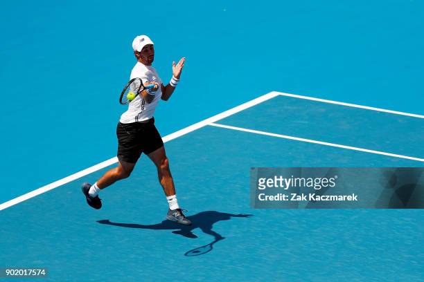 Jordan Thompson of Australia plays a forehand in his first round match against Paolo Lorentzi of Italy during day one of the 2018 Sydney...