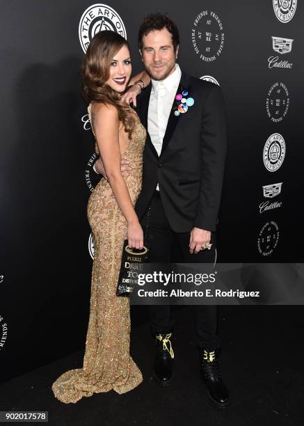 Brittney Palmer and Gregory Siff attend The Art Of Elysium's 11th Annual Celebration on January 6, 2018 in Santa Monica, California.