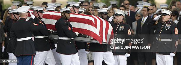 Marine Corps Sergeant William Cahir's casket is carried by a US Marine Corps honor guard during his funeral serivce at Arlington National Cemetery in...