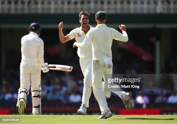 Pat Cummins of Australia celebrates taking the wicket of James Vince of England during day four of the Fifth Test match in the 2017/18 Ashes Series...