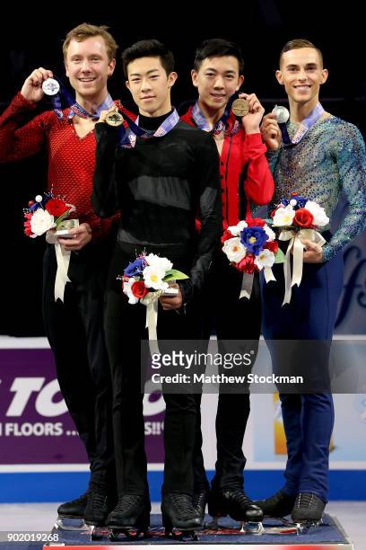 Ross Miner, Nathan Chen, Vincent Zhou and Adam Rippon pose for photographers after the medal ceremony for the Championship Men's during the 2018...