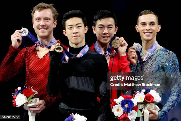 Ross Miner, Nathan Chen, Vincent Zhou and Adam Rippon pose for photographers after the medal ceremony for the Championship Men's during the 2018...