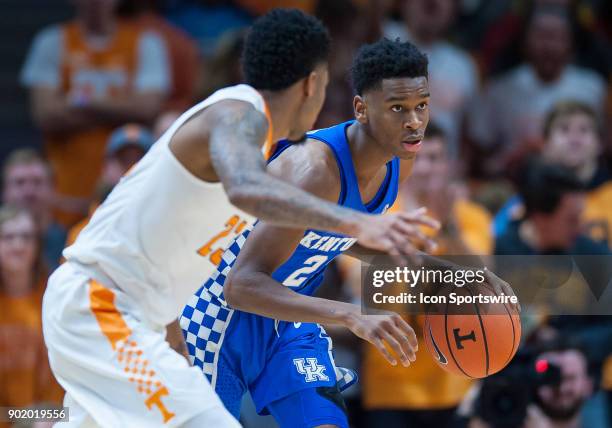 Kentucky Wildcats forward Jarred Vanderbilt is guarded by Tennessee Volunteers guard Jordan Bowden during a game between the Kentucky Wildcats and...