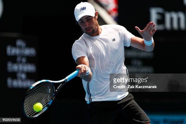 Jordan Thompson of Australia plays a forehand in his first round match against Paolo Lorentzi of Italy during day one of the 2018 Sydney...