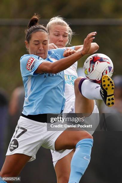 Kim Carroll of Perth Glory and Kyah Simon of Melbourne City contest the ball during the round ten W-League match between Melbourne City and Perth...