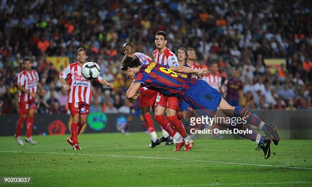 Zlatan Ibrahimovic of Barcelona scores his first goal for Barcelona during the La Liga match between Barcelona and Sporting Gijon at the Nou Camp...