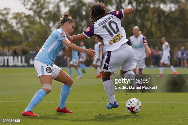 Raquel Rodriguez of Perth Glory and Stephanie Catley of Melbourne City contest the ball during the round ten W-League match between Melbourne City...