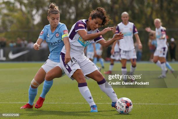 Raquel Rodriguez of Perth Glory and Stephanie Catley of Melbourne City contest the ball during the round ten W-League match between Melbourne City...