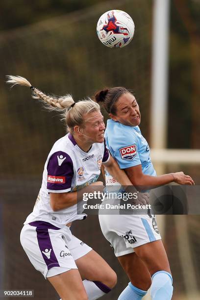 Kyah Simon of Melbourne City and Kim Carroll of Perth Glory contest the ball during the round ten W-League match between Melbourne City and Perth...