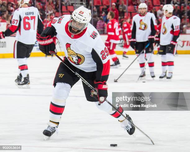 Johnny Oduya of the Ottawa Senators shoots the puck in warm-ups prior to an NHL game against the Detroit Red Wings at Little Caesars Arena on January...