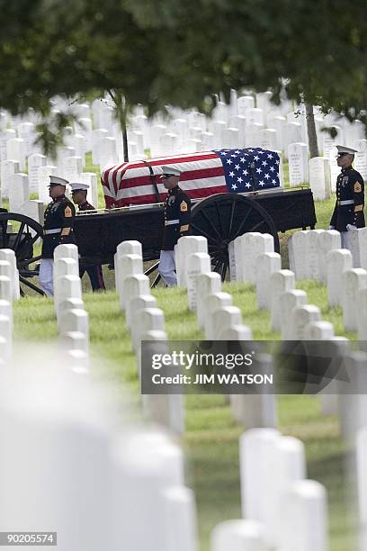 Marine Corps Sergeant William Cahir's casket is brought by caisson to his funeral serivce at Arlington National Cemetery in Arlington, Virginia, on...