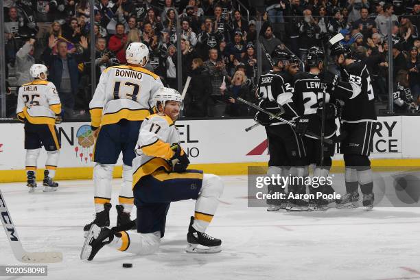 Alex Iafallo, Nick Shore, Trevor Lewis, and Kevin Gravel of the Los Angeles Kings celebrate after scoring a goal against the Nashville Predators at...