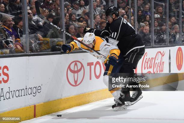 Anze Kopitar of the Los Angeles Kings battles for the puck against Yannick Weber of the Nashville Predators at STAPLES Center on January 6, 2018 in...