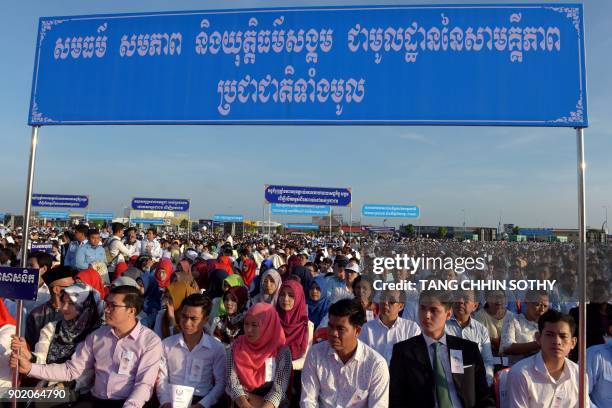 People attend the Cambodian People's Party ceremony marking the 39th anniversary of the fall of the Khmer Rouge regime in Phnom Penh on January 7,...