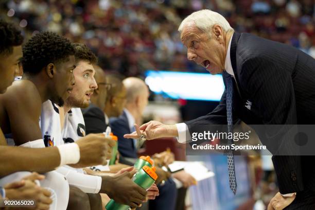 North Carolina head coach Roy Williams talks with his team during the game between the North Carolina Tar Heels and the Florida State Seminoles at...
