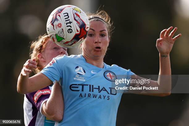 Jodie Taylor of Melbourne City and Shannon May of Perth Glory contest the ball during the round ten W-League match between Melbourne City and Perth...