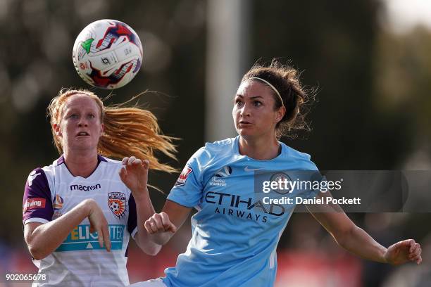 Jodie Taylor of Melbourne City and Shannon May of Perth Glory contest the ball during the round ten W-League match between Melbourne City and Perth...