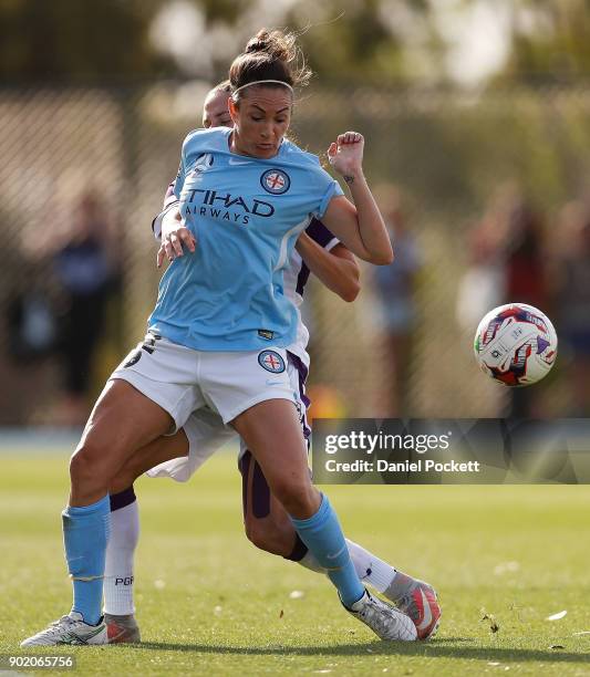 Jodie Taylor of Melbourne City and Amanda Frisbie of Perth Glory contest the ball during the round ten W-League match between Melbourne City and...