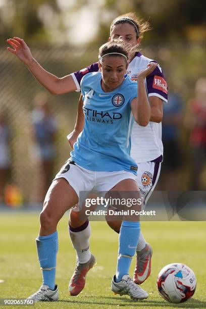 Jodie Taylor of Melbourne City and Amanda Frisbie of Perth Glory contest the ball during the round ten W-League match between Melbourne City and...