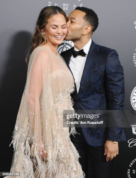 Chrissy Teigen and John Legend attend The Art Of Elysium's 11th Annual Celebration - Heaven at Barker Hangar on January 6, 2018 in Santa Monica,...