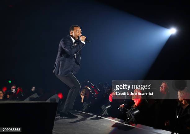 John Legend performs onstage during the Moet Hennessy John Legend's HEAVEN with the Art of Elysium at Barker Hangar on January 6, 2018 in Santa...
