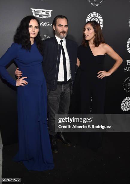 Rain Phoenix, Joaquin Phoenix, and Summer Phoenix attend The Art Of Elysium's 11th Annual Celebration on January 6, 2018 in Santa Monica, California.