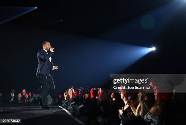 John Legend performs onstage during the Moet Hennessy John Legend's HEAVEN with the Art of Elysium at Barker Hangar on January 6, 2018 in Santa...