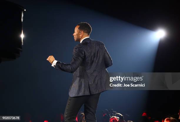 John Legend performs onstage during the Moet Hennessy John Legend's HEAVEN with the Art of Elysium at Barker Hangar on January 6, 2018 in Santa...