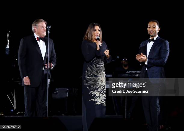 Art of Elysium's chairman of the board Tim Headington and founder Jennifer Howell present John Legend with the Visionary & Spirit of Elysium award at...