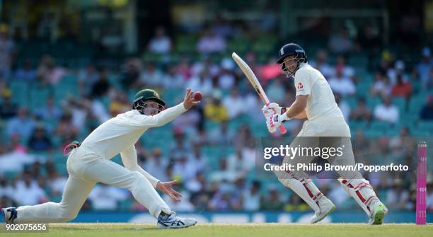 Joe Root of England hits the ball past Cameron Bancroft of Australia during the fourth day of the fifth Ashes cricket test match between Australia...