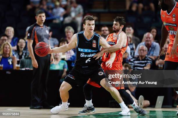 Kirk Penney of the Breakers backs into Jarrad Weeks of the Taipans during the round 13 NBL match between the New Zealand Breakers and the Cairns...