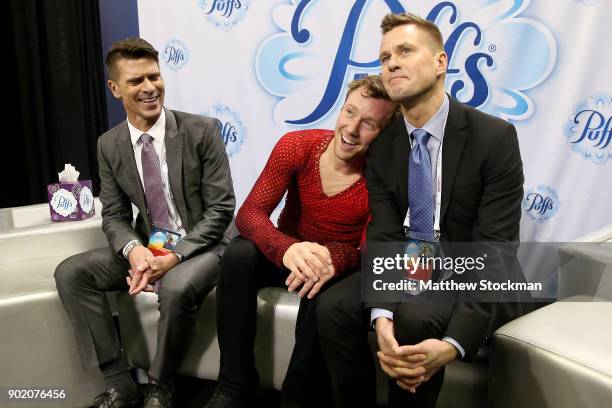 Ross Miner celebrates in the kiss and cry with his coaches Mark Mitchell and Peter Johansson after skating in the the Men's Free Skate during the...