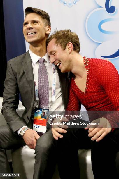 Ross Miner celebrates in the kiss and cry with his coach Mark Mitchell after skating in the the Men's Free Skate during the 2018 Prudential U.S....