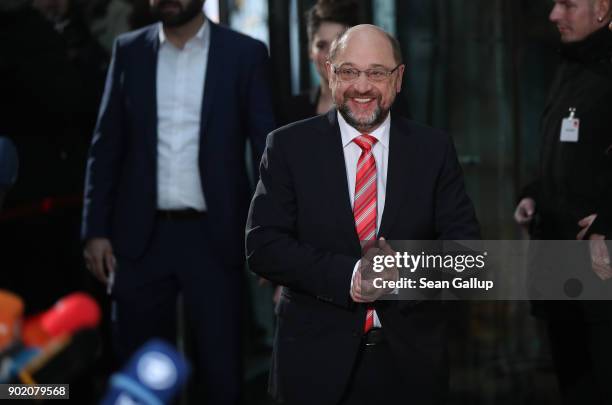 Martin Schulz, head of the German Social Democrats , arrives to speak to the media outside SPD headquarters prior to preliminary coalition talks on...