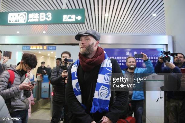 Icelandic footballer Eidur Gudjohnsen arrives by train as he prepares to join Shijiazhuang Ever Bright F.C. Of the China League One on January 6,...