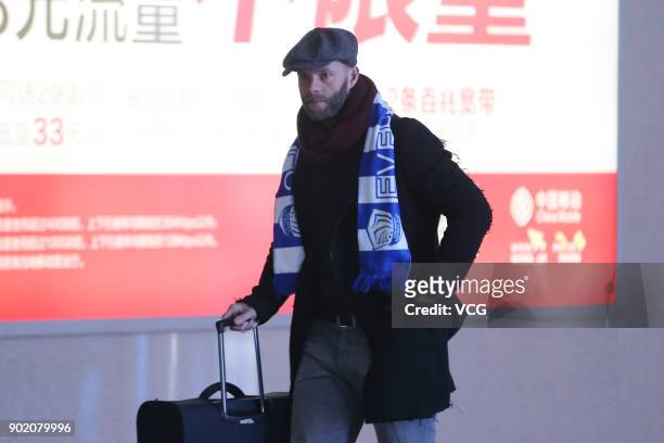Icelandic footballer Eidur Gudjohnsen arrives by train as he prepares to join Shijiazhuang Ever Bright F.C. Of the China League One on January 6,...