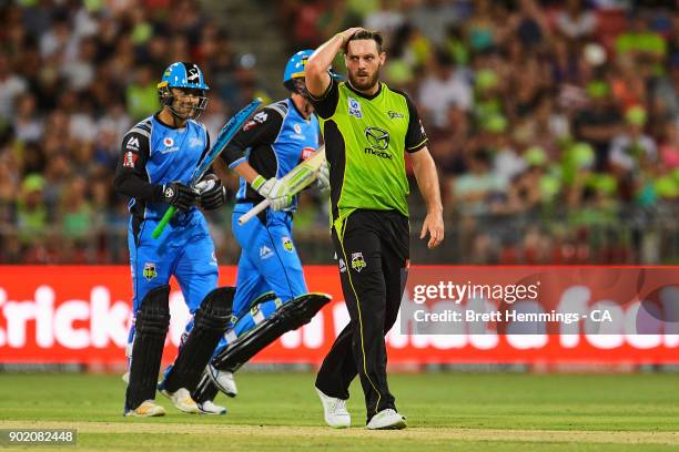 Mitch McClenaghan of the Thunder reacts after being hit for a six during the Big Bash League match between the Sydney Thunder and the Adelaide...