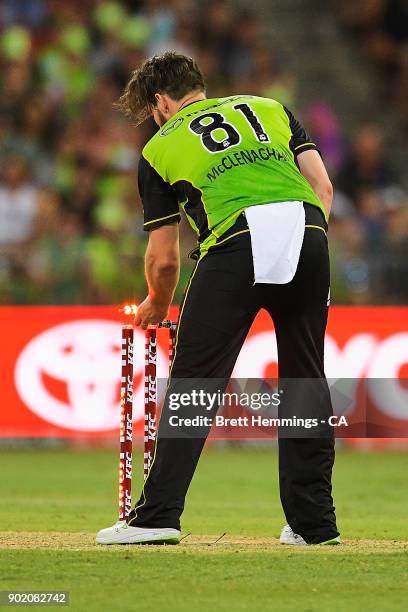 Mitch McClenaghan of the Thunder runs out Jake Lehmann of the Strikers during the Big Bash League match between the Sydney Thunder and the Adelaide...