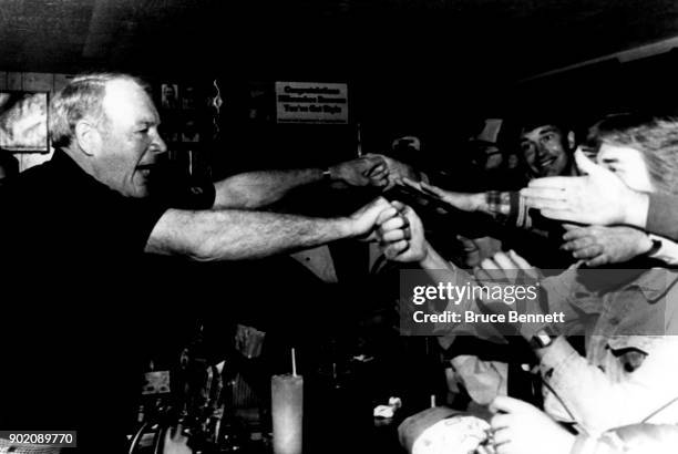 Manager Harvey Kuenn of the Milwaukee Brewers is mobbed by fans at Harvey's Bar after the 1982 World Series Game 4 against the St. Louis Cardinals on...