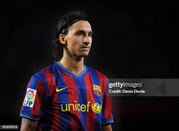 Zlatan Ibrahimovic of Barcelona waits for play to resume during the La Liga match between Barcelona and Sporting Gijon at the Nou Camp stadium on...