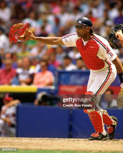 Sandy Alomar Jr. Of the Cleveland Indians catches during an MLB game at Municipal Stadium in Cleveland, Ohio during the 1990 season.