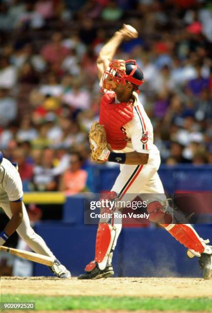 Sandy Alomar Jr. Of the Cleveland Indians catches during an MLB game at Municipal Stadium in Cleveland, Ohio during the 1990 season.