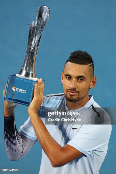 Nick Kyrgios of Australia holds the winners trophy after the Men's Final match against Ryan Harrison of the USA during day eight of the 2018 Brisbane...