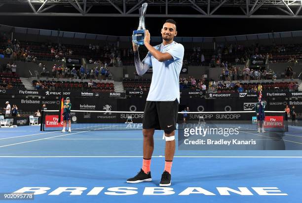 Nick Kyrgios of Australia holds up the winners trophy after winning the Men's Final match against Ryan Harrison of the USA during day eight of the...