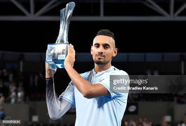 Nick Kyrgios of Australia holds up the winners trophy after winning the Men's Final match against Ryan Harrison of the USA during day eight of the...