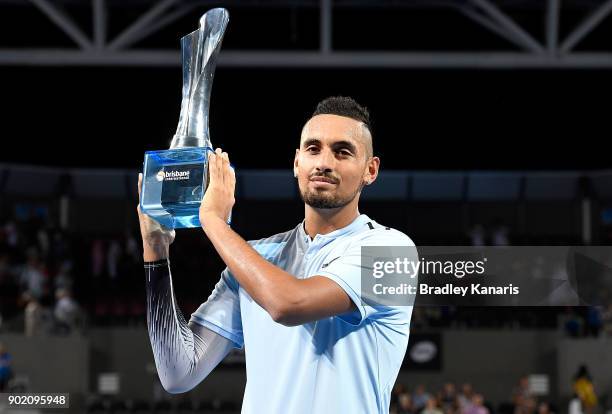 Nick Kyrgios of Australia holds up the winners trophy after winning the Men's Final match against Ryan Harrison of the USA during day eight of the...