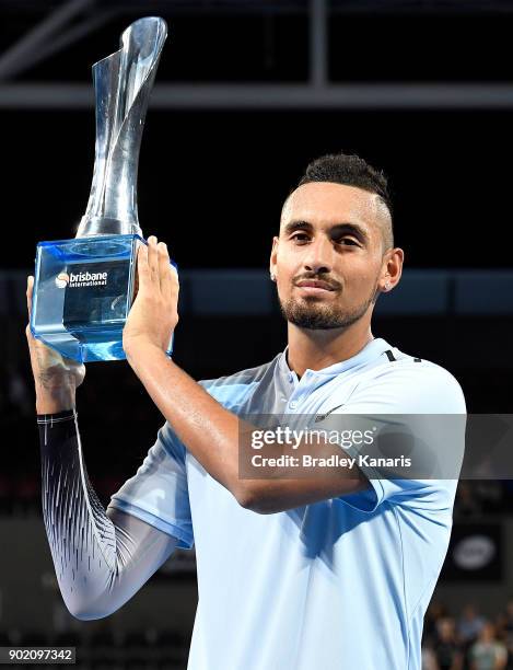 Nick Kyrgios of Australia holds up the winners trophy after winning the Men's Final match against Ryan Harrison of the USA during day eight of the...