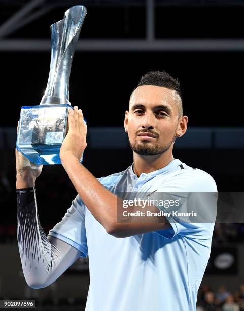 Nick Kyrgios of Australia holds up the winners trophy after winning the Men's Final match against Ryan Harrison of the USA during day eight of the...